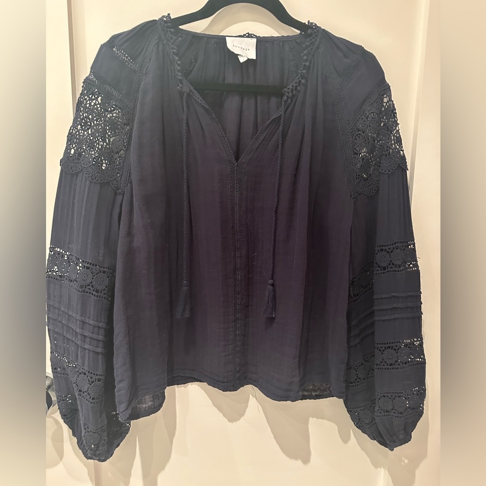 Sunday’s navy top with place trim